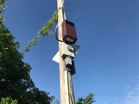 black box on electric pole|strange boxes on utility poles.